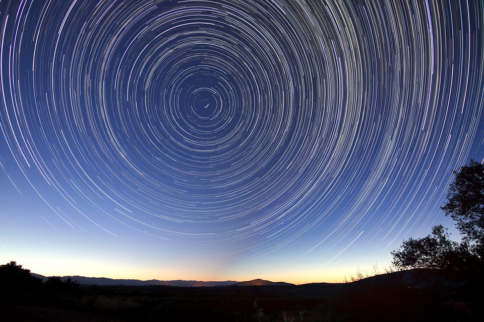 sunset with circling star trails